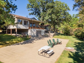 Large fire pit and dining area right next to the lake.