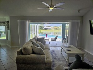 Stunning views of the pool and pond from the living room.