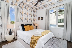 2nd bedroom with Queen bed, smart TV, walk-in closet, and jack-n-jill en-suite bathroom. (3rd Floor)