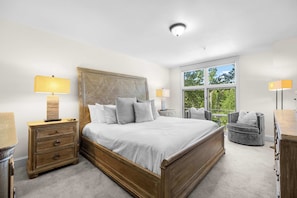 Bedroom 1: Main floor, king bed, en-suite bathroom, dresser, 75” Samsung smart TV, mini fridge, microwave, drip coffee maker, toaster, dresser