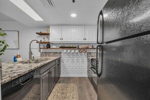 Kitchen: Main floor, Keurig, blender, toaster, cooking utensils, tableware