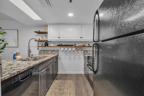 Kitchen: Main floor, Keurig, blender, toaster, cooking utensils, tableware