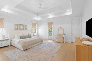 Spacious primary suite with tray ceilings.