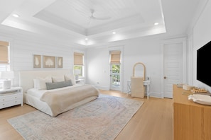 Spacious primary suite with tray ceilings.