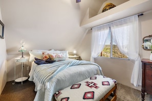The main bedroom offers a dreamy escape with a plush queen bed, soft natural light, colorful Southwestern accents, and cozy textures that invite total relaxation. 🛏️☀️🌿