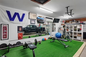 No need to leave the home to get your workout in...we have a full gym in the garage with plenty of room to park your full sized vehicle. Climate controlled and equipped wikth a tv!