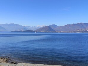 Sky, Blue, Water, Water Resources, Mountainous Landforms, Body Of Water, Mountain, Horizon, Coastal And Oceanic Landforms, Hill