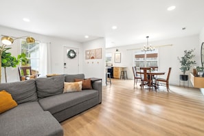 When you walk into our home, you will find an open concept living room, kitchen, and dining space.