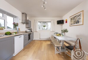 The Coach House, Trelights. Ground floor: The kitchen/dining area is well-equipped for your stay
