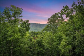Relax on the deck with seating and Smoky Mountain views