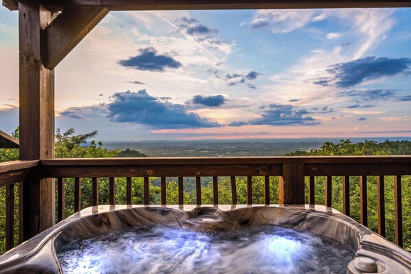 Relax in the bubbling hot tub with breathtaking views
