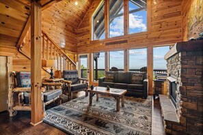Cozy living area with fireplace & 65" smart TV