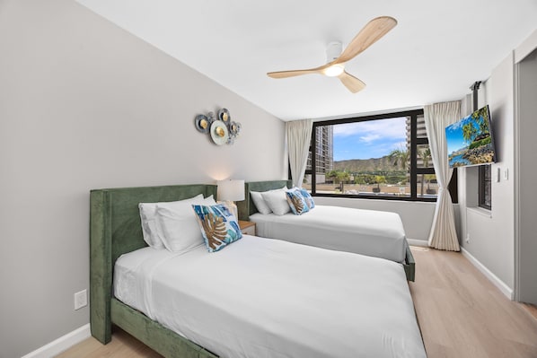 Relax in your bedroom with a queen-sized and a twin-sized bed