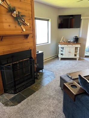Fireplace, smart tv, pull out couch and games in the living area