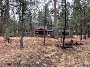 A view of the entire back of the house from the bike path