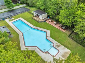 Unwind poolside on the spacious deck, letting the surrounding trees set the vibe.