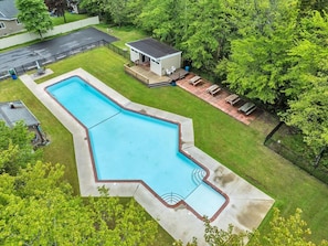 Unwind poolside on the spacious deck, letting the surrounding trees set the vibe.