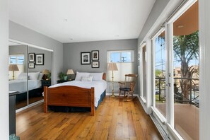 Wake up to sunshine and serenity in this beautifully curated bedroom.