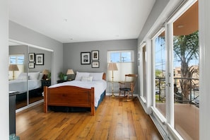 Wake up to sunshine and serenity in this beautifully curated bedroom.