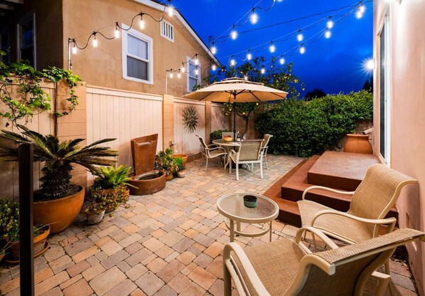 Backyard bliss under the string lights – your private retreat awaits