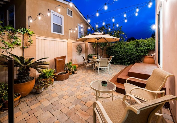 Backyard bliss under the string lights – your private retreat awaits