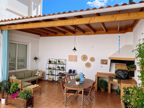 Spacious patio with barbecue, dining and seating area