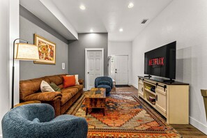 Bright tones and an open layout bring energy and comfort into one unforgettable living space.