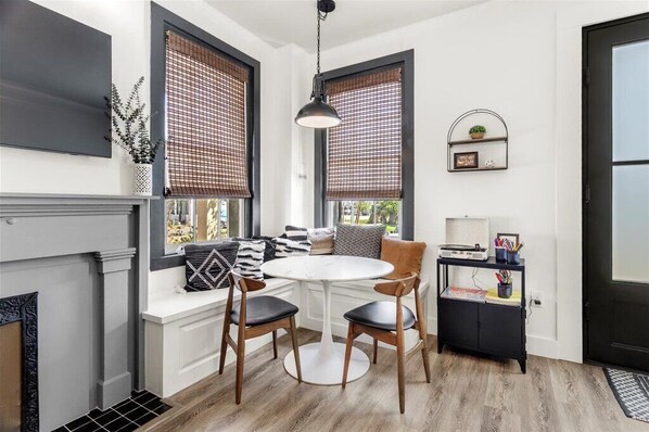 The banquette provides ample seating for this corner dining nook. 