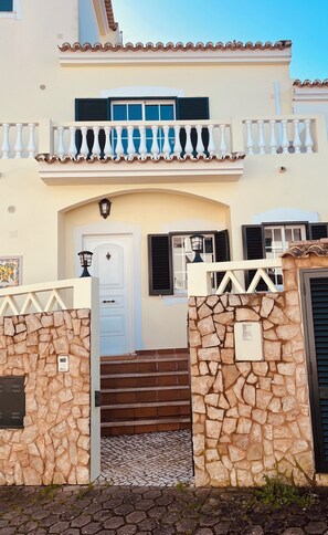 Private entrance with street parking in front of house