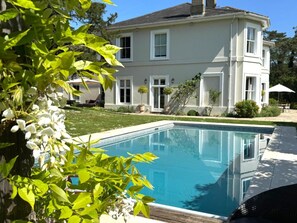 Poolside view of house