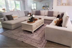 An over sized sofa sectional for sprawling out and watching a movie or a game.
