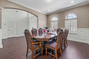 Formal Dining Room at entrance of home with service for 8.