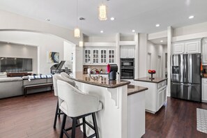 Open concept kitchen/living room.  Dining room is right down the short hallway. 