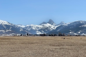 The living areas and primary bedroom all enjoy spectacular views of the beautiful Tetons.