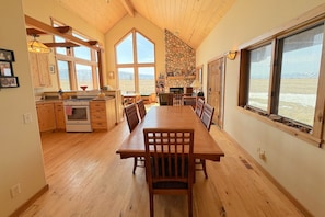 Gather around the dining table for food, conversation, and fun.