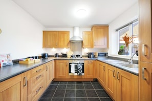 Kitchen with complimentary tea coffee biscuits, kettle, toaster, rice cooker microwave, air fryer & Cafeteria