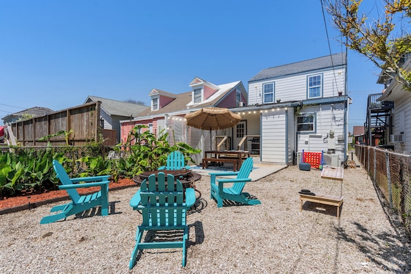 Outdoor area with adirondack chairs and firepit