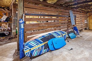 beach chairs, umbrella, boogie and paddle boards for your use
