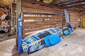 beach chairs, umbrella, boogie and paddle boards for your use
