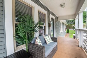Welcome to Serenity: Embrace the charm of our welcoming front patio, where relaxation begins.  Get in touch to explore our custom concierge services and local experiences curated just for you.