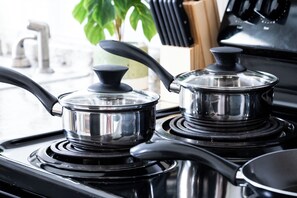 Culinary Delight: Our modern kitchen is fully equipped with updated appliances and ample counter space, ready for your gourmet meals. 