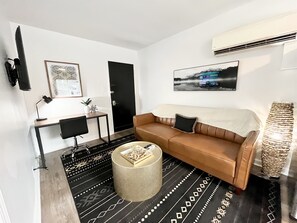 Neutral living space to relax and watch all of your favorite shows