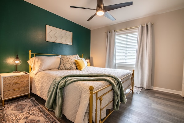 Enjoy a restful night in this cozy, stylish bedroom—where comfort meets charm. → Message us now to book your stay in the Magic City!