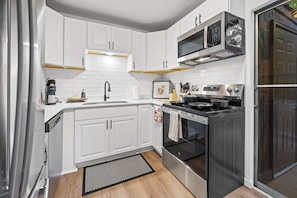 Experience culinary convenience in our fully equipped kitchen, featuring modern appliances and essentials for your stay.