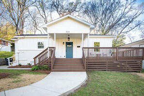 Cute Crestwood cottage with ramp access, front yard, and warm curb appeal.
