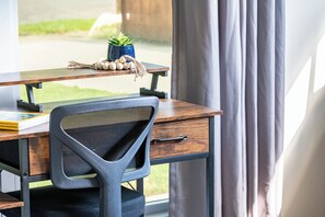 Dedicated workspace in the front bedroom perfect for productivity. Discover more for your stay at Legacy Stays! www.legacystays.org