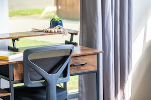 Dedicated workspace in the front bedroom perfect for productivity. Discover more for your stay at Legacy Stays! www.legacystays.org