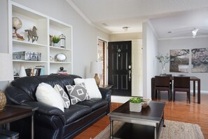 Cozy Living Area: Relax in this inviting living space featuring comfortable seating and a warm, welcoming atmosphere.