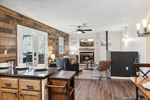 The heart of the home: Where delicious meals meet entertainment in our open kitchen-living space. We even have a smart TV with all of your favorite subscription services. *please note that the fireplace is not working for guests*
