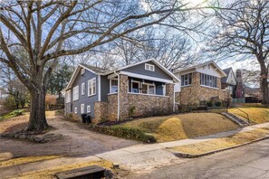 Street view of the blue "Pond Pad", with beautiful stone work and a great view from the front porch, your morning coffee just got an upgrade.  